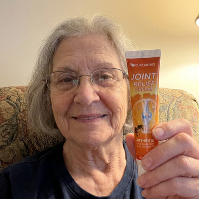 Customer holding Joint Relief Cream